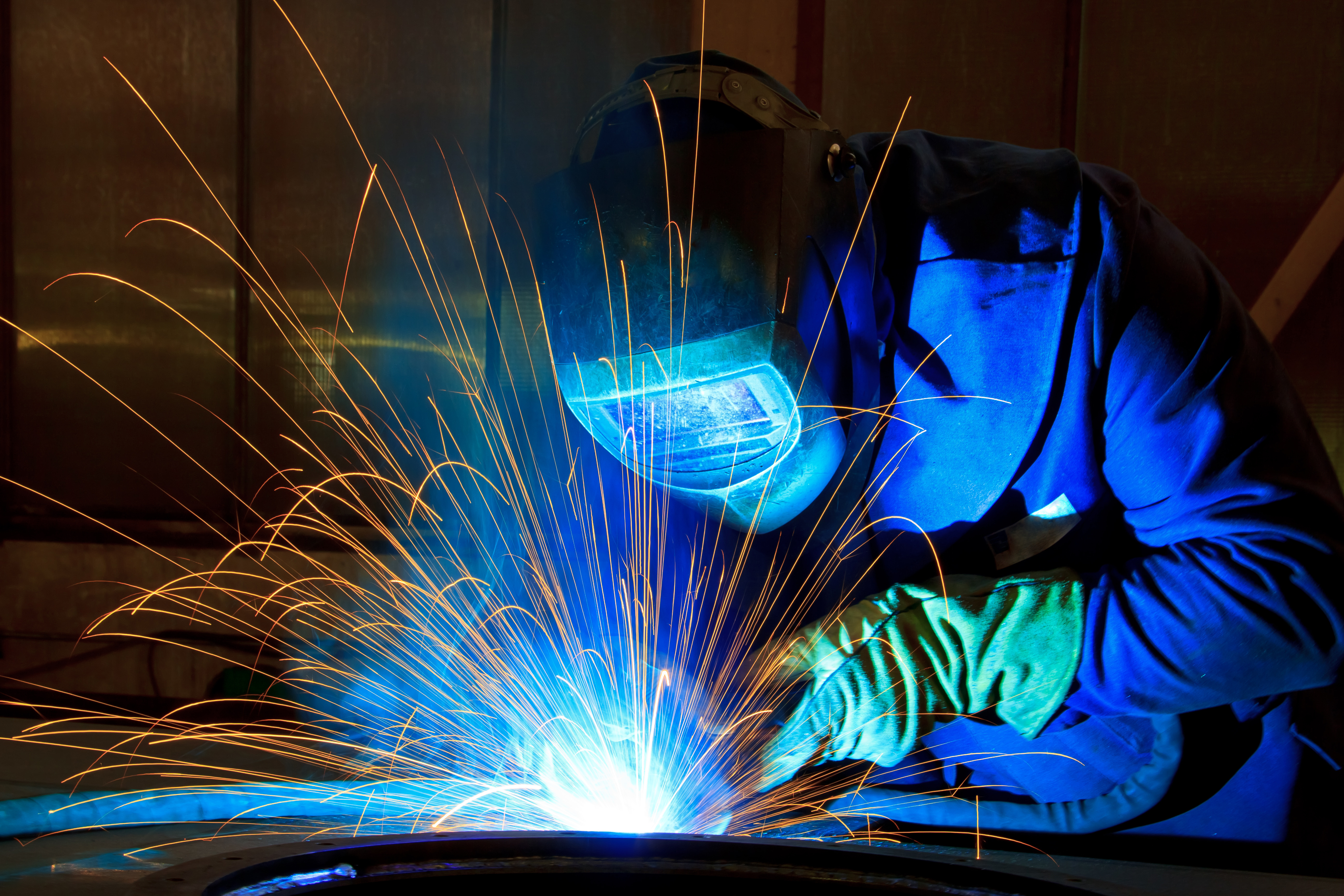 Welder at an industrial facility